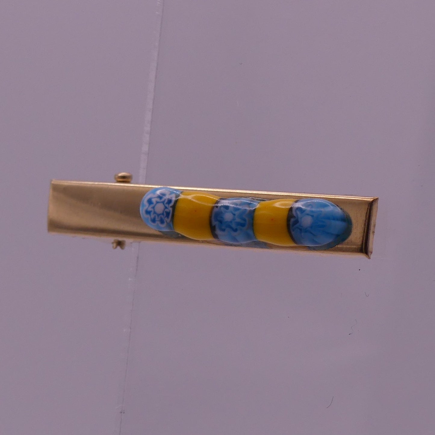 Pince à cheveux jaune et bleu