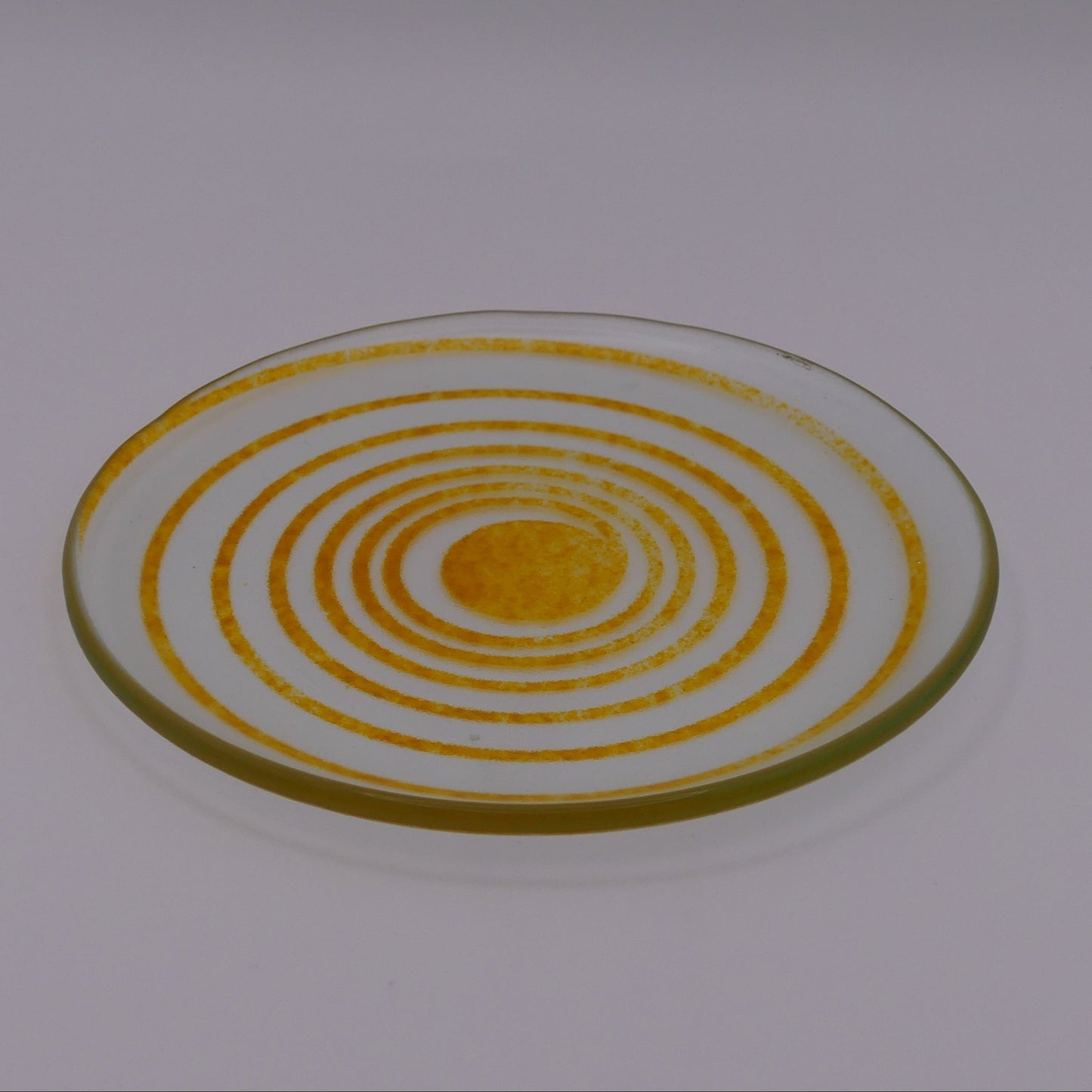 Assiette à thé spirale transparente orange