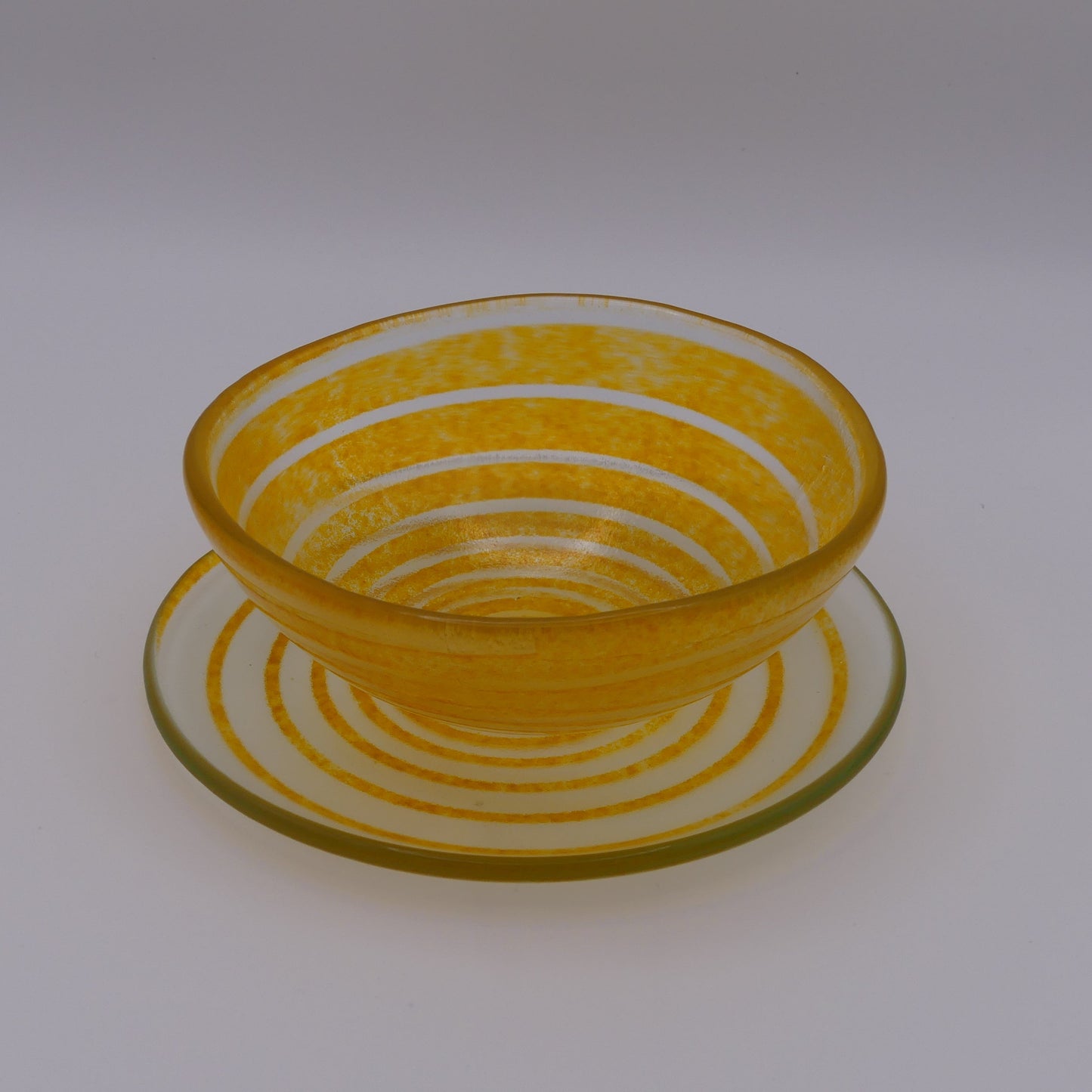 Assiette à thé spirale transparente orange