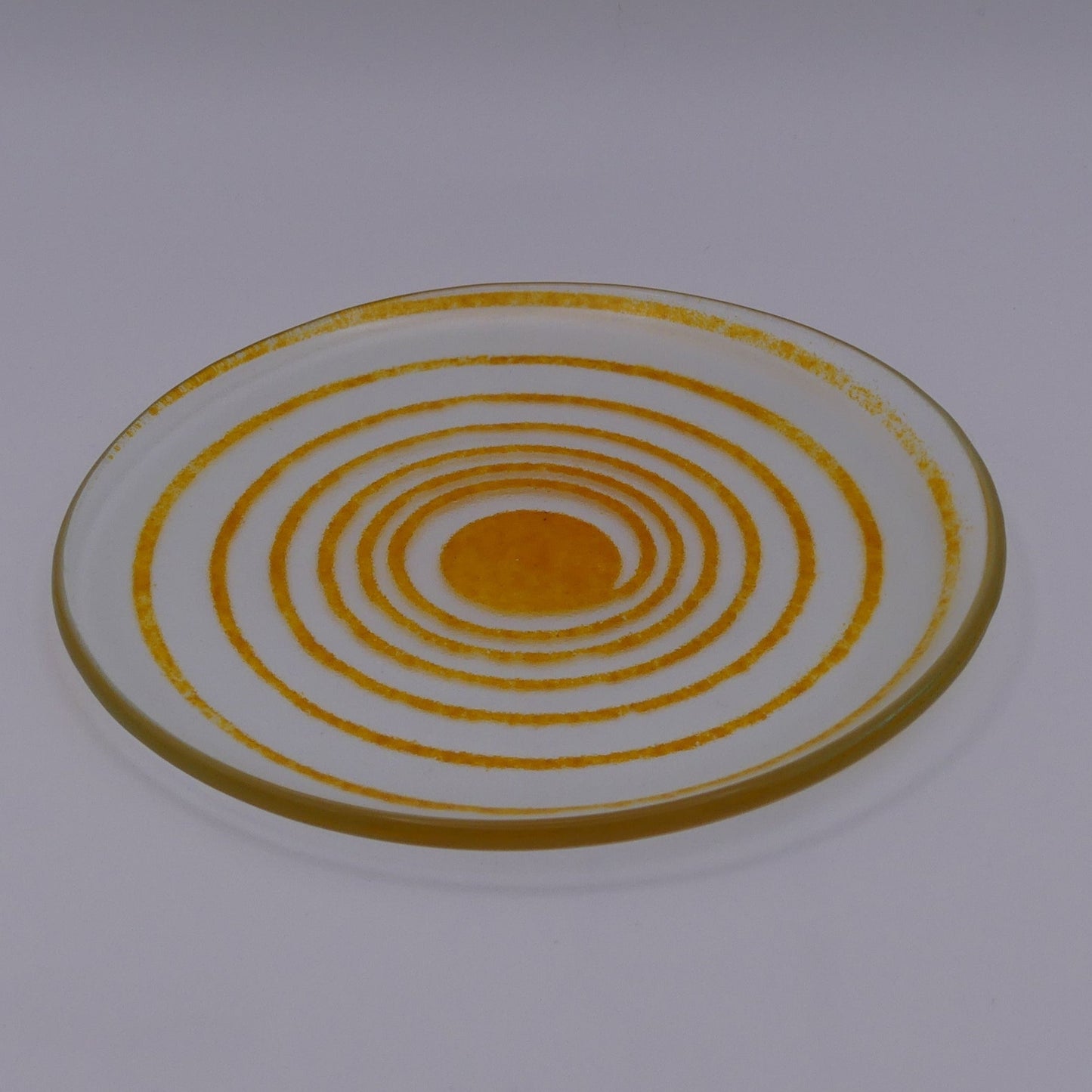 Assiette à thé spirale transparente orange