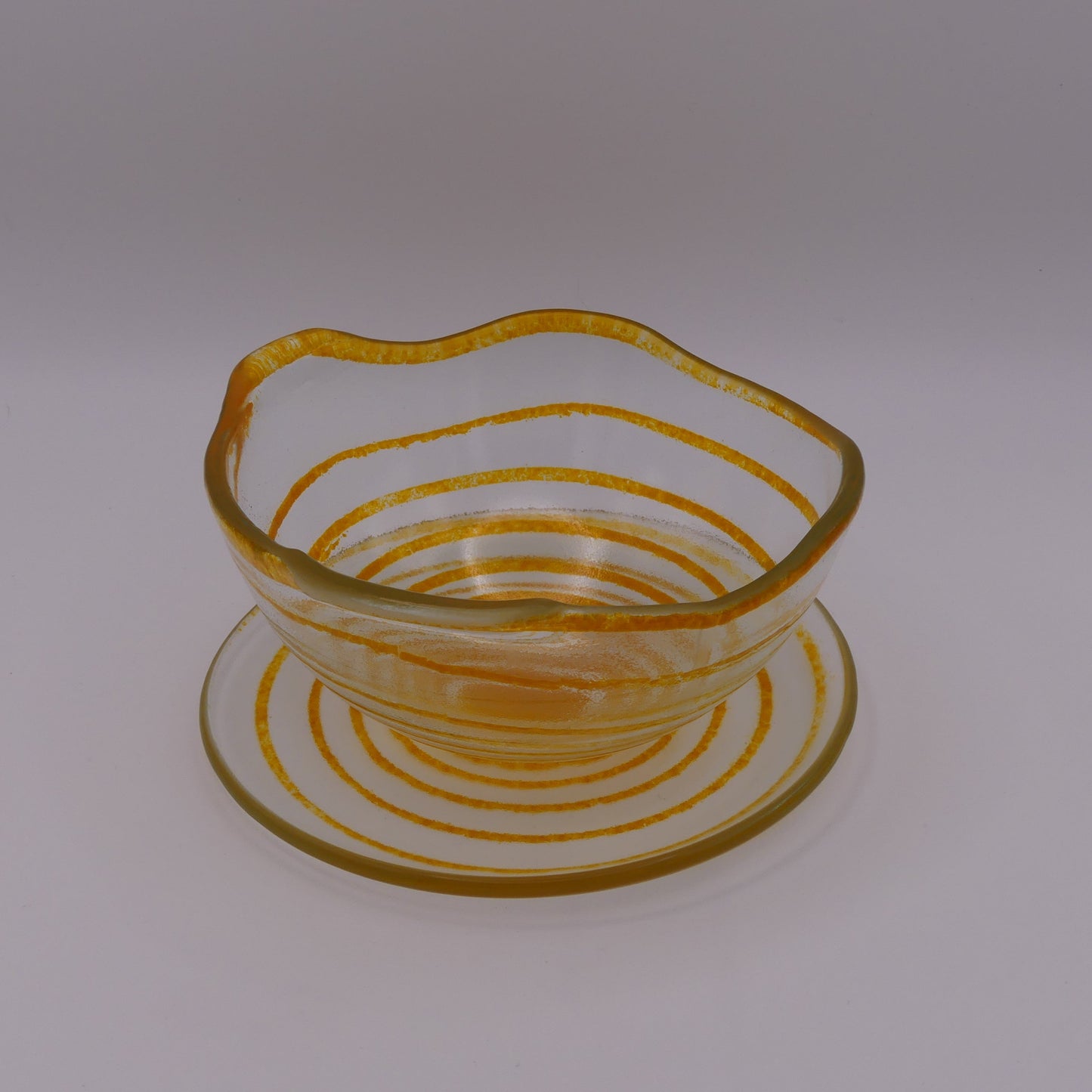 Assiette à thé spirale transparente orange