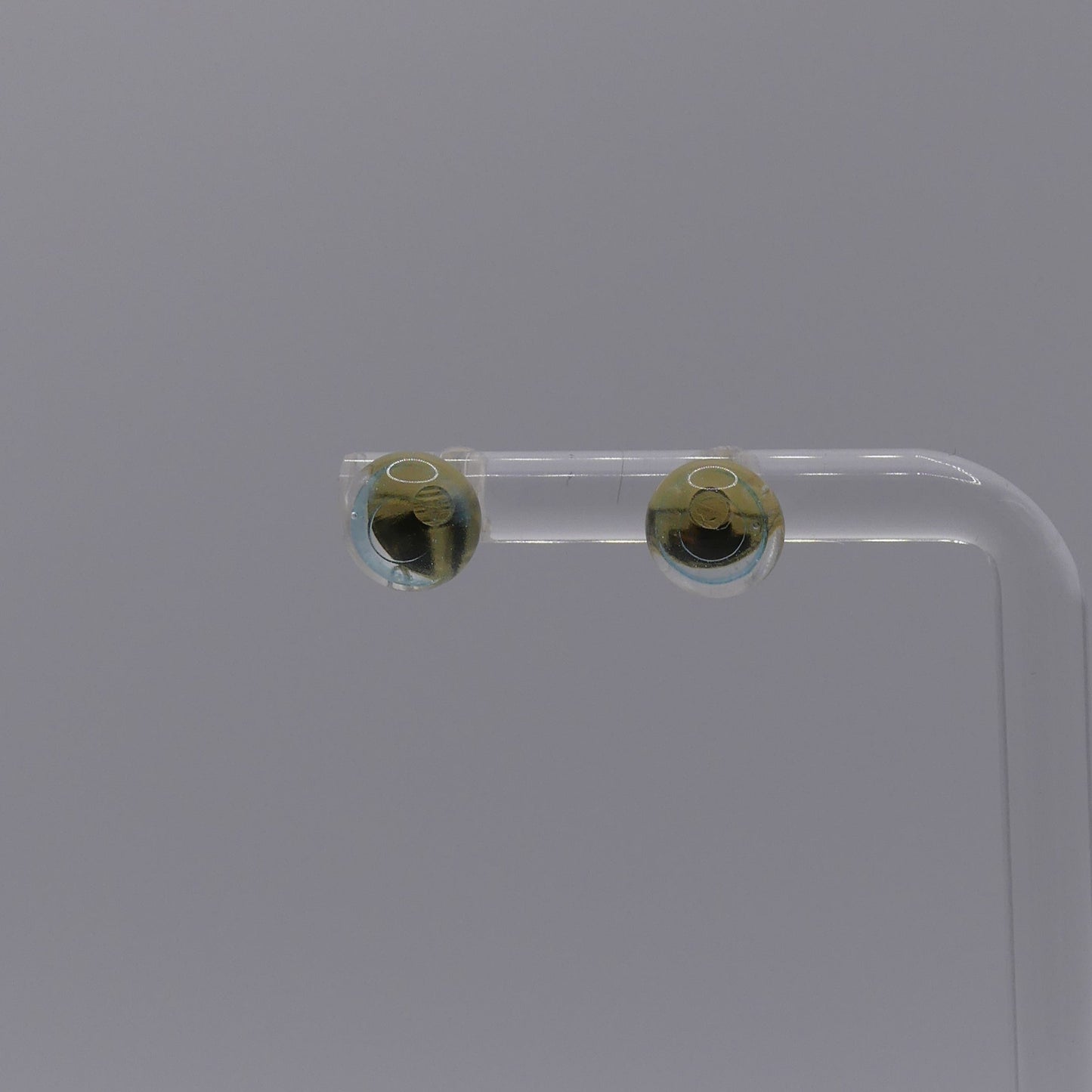 Clous d'oreilles bleu transparent