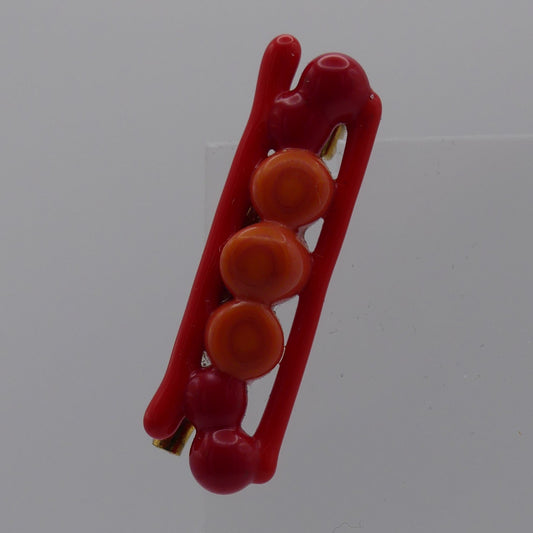 Broche rouge orange