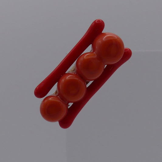 Broche rouge orange