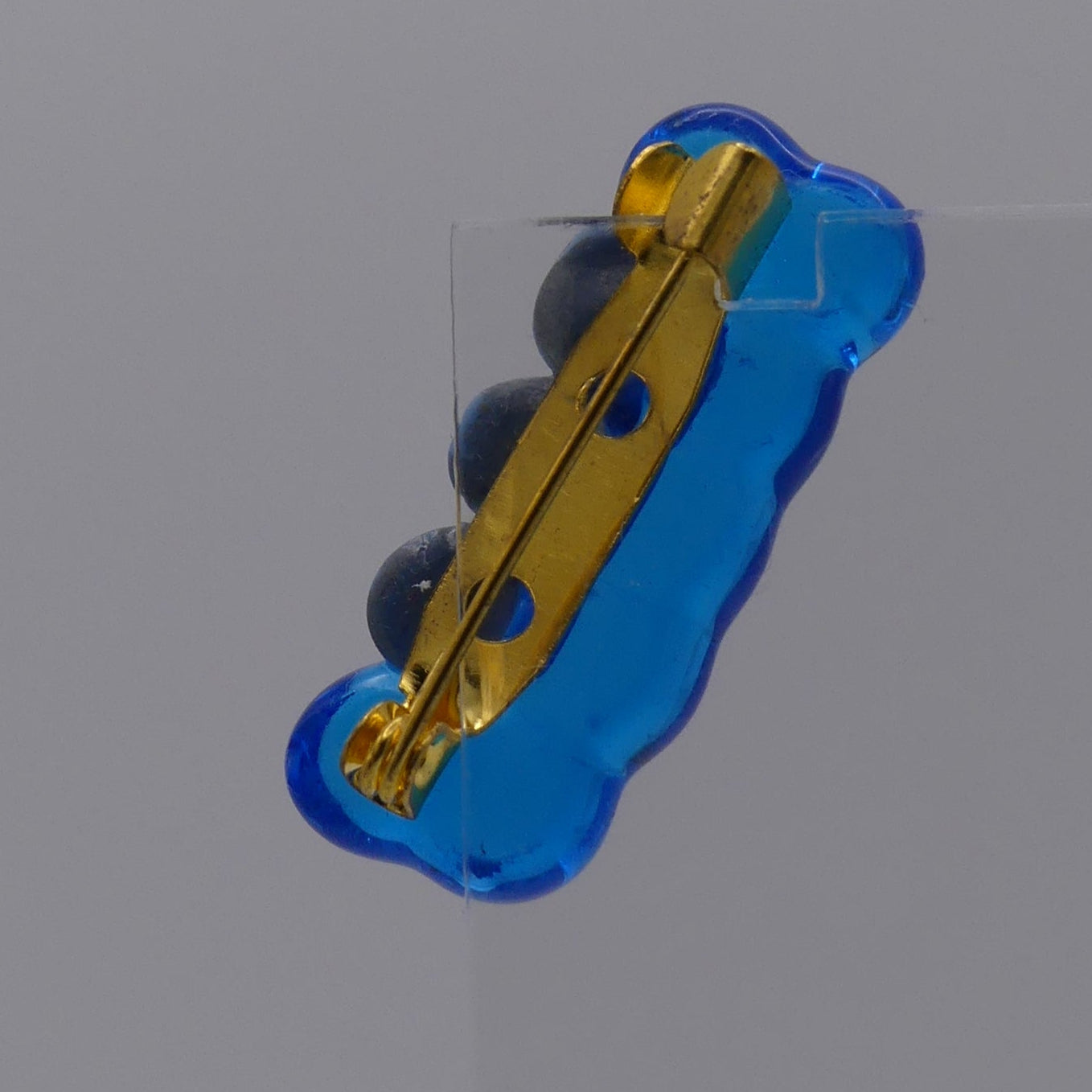 Broche bleu