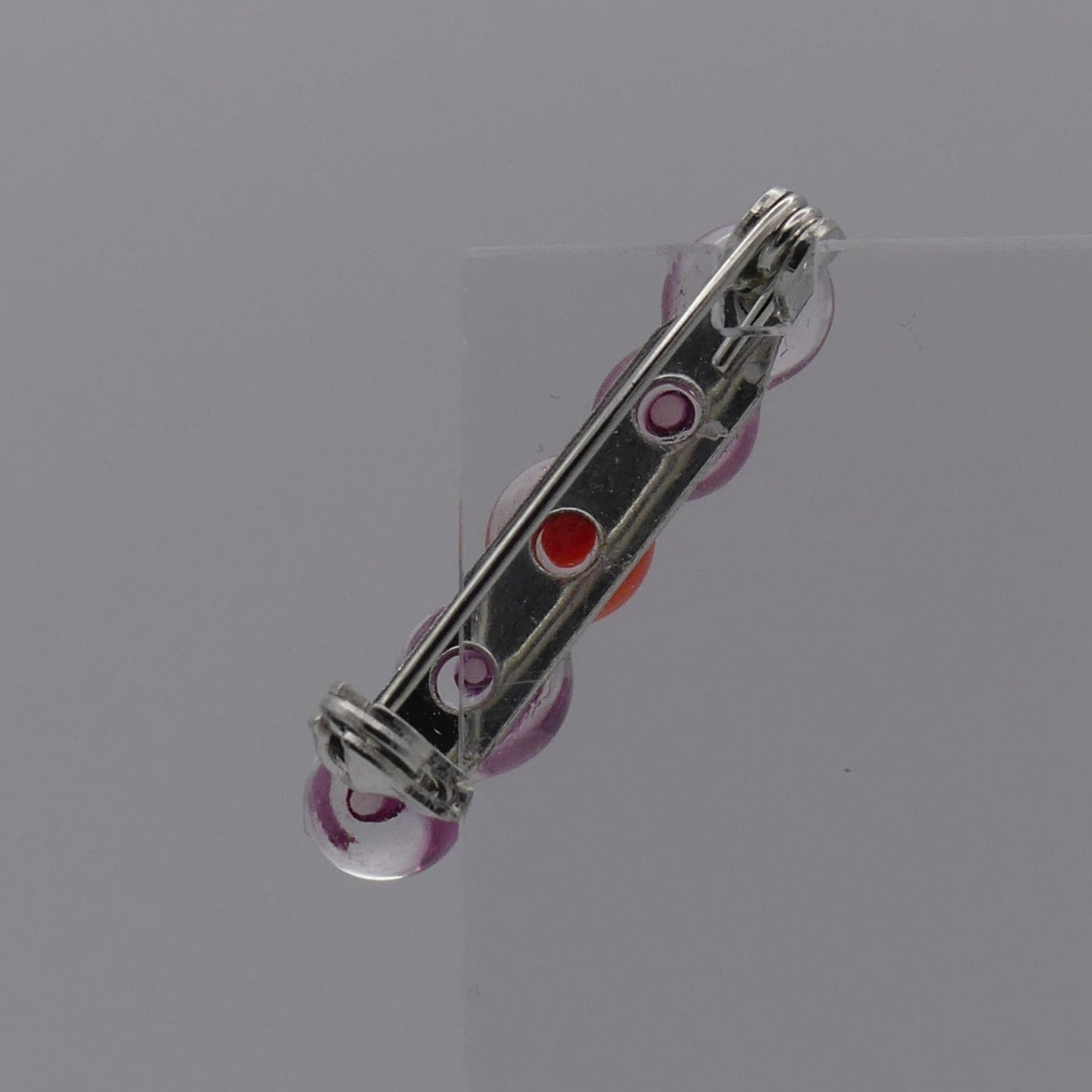 Broche rose orange