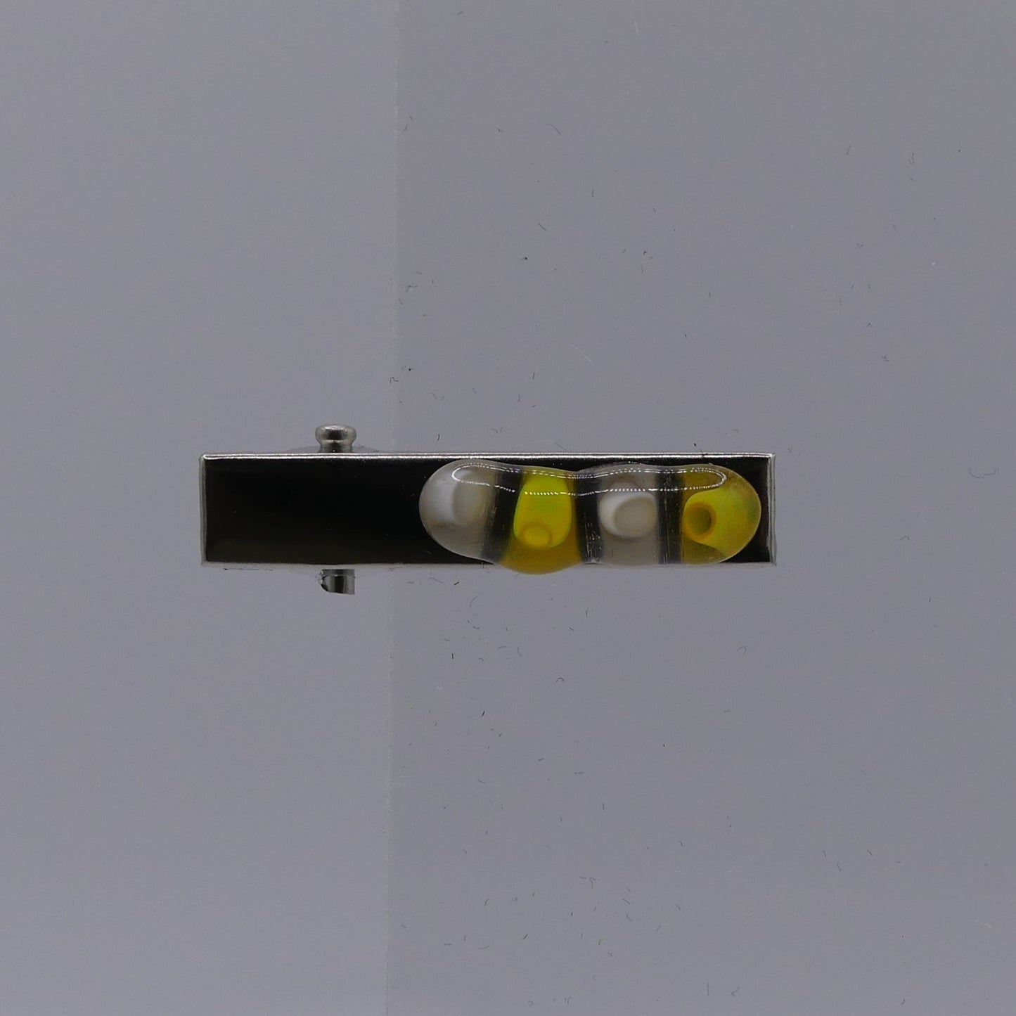 Pince à cheveux blanc jaune