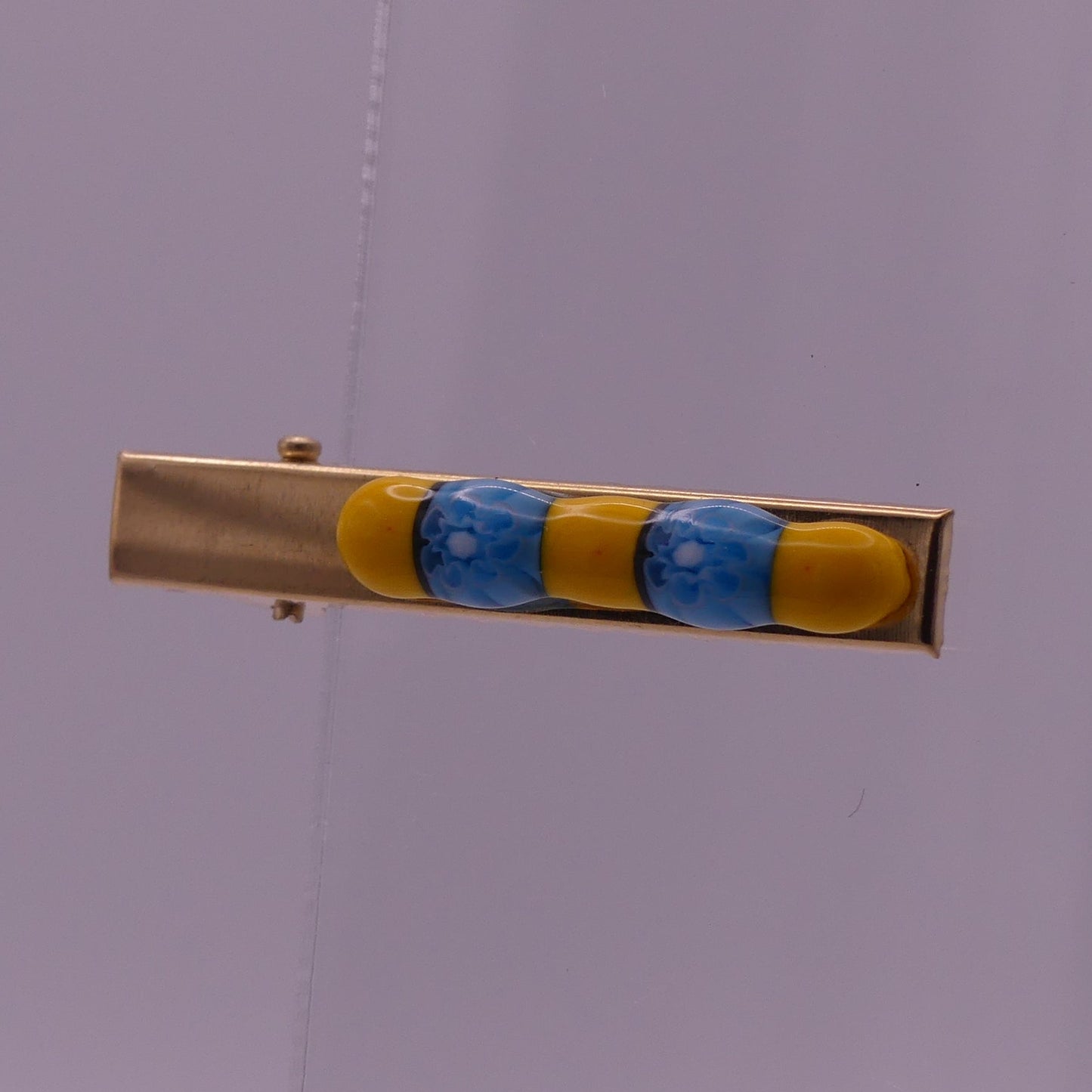 Pince à cheveux jaune et bleu