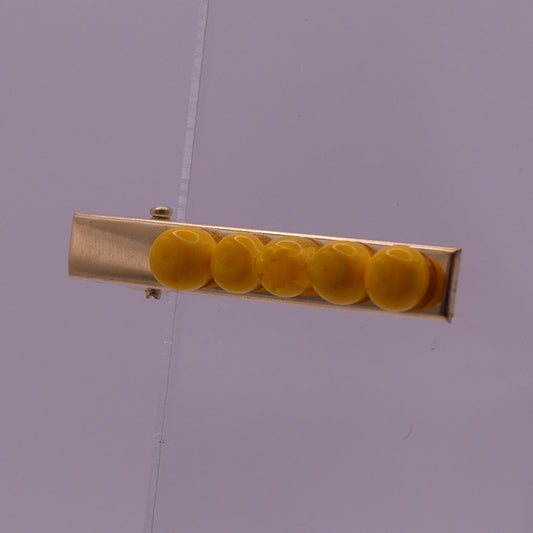 Pince à cheveux jaune