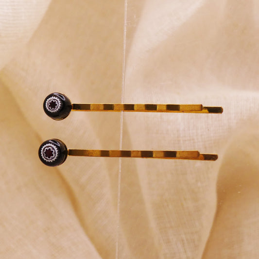 Pinces à cheveux noires motifs