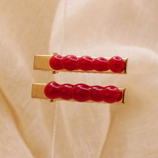 Pince à cheveux rouge