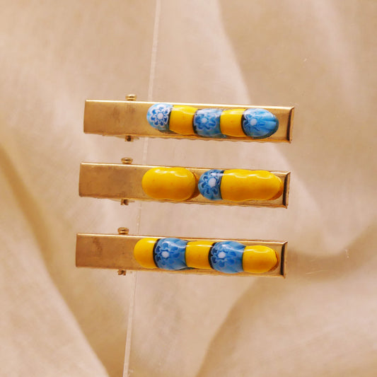 Pince à cheveux jaune et bleue